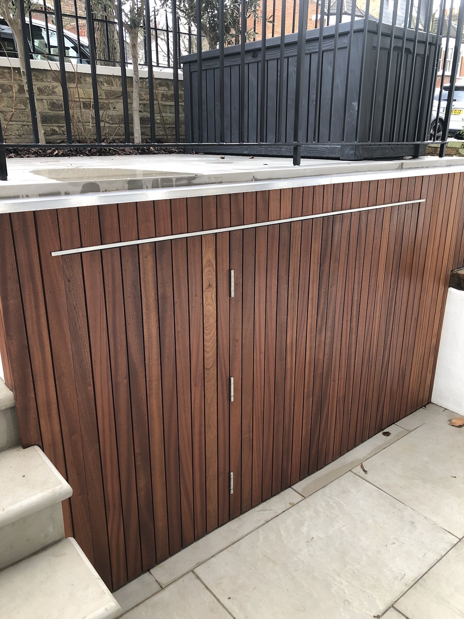 Timber bin storage built by Shoots & Leaves beside a London house