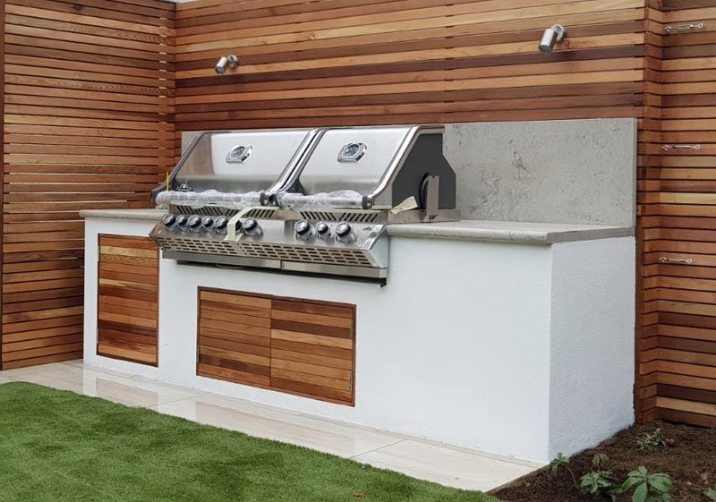Outdoor kitchen built by Shoots & Leaves in a garden terrace